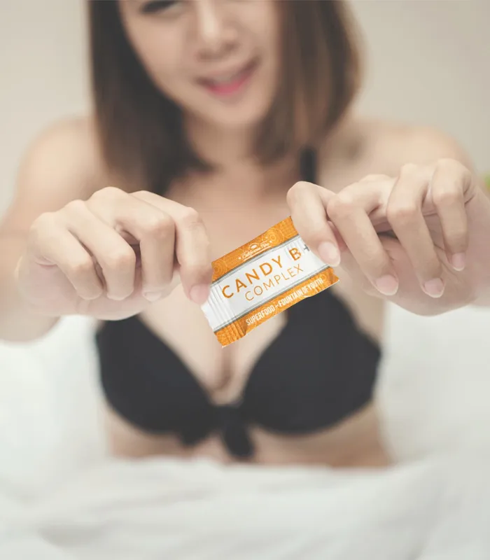Sexy woman holding candy B